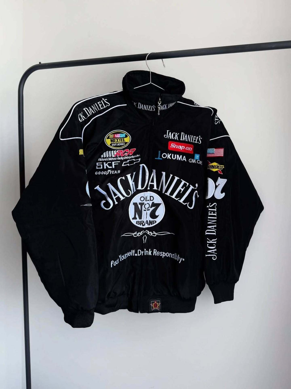 jack daniels f1 jacket, jack daniels racing jacket, jack daniels embroidered jacket, jack daniels moto jacket, black jack daniels jacket, f1 racing jacket india, paper castle jacket, streetwear jacket, oversized streetwear jacket, premium streetwear india, trendy jackets for men, unisex bomber jacket, heavy embroidery jacket, premium quality jacket, biker style jacket, motorsport jacket, formula 1 jacket, racing team jacket, motorsports apparel, f1 fan merchandise, best jackets for men india, affordable rac